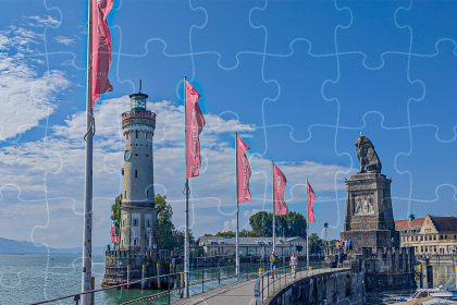Porto di Linau con faro e leone in Germania. Foto 'puzzle' sul blog di viaggi "Nerd in Spalla: viaggiatori poco seri"